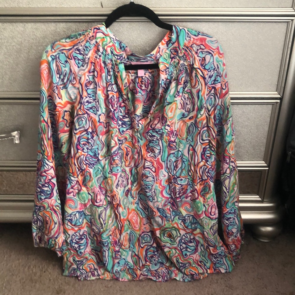 Lily Pulitzer silk blouse: some slight tearing around seam on sleeve
